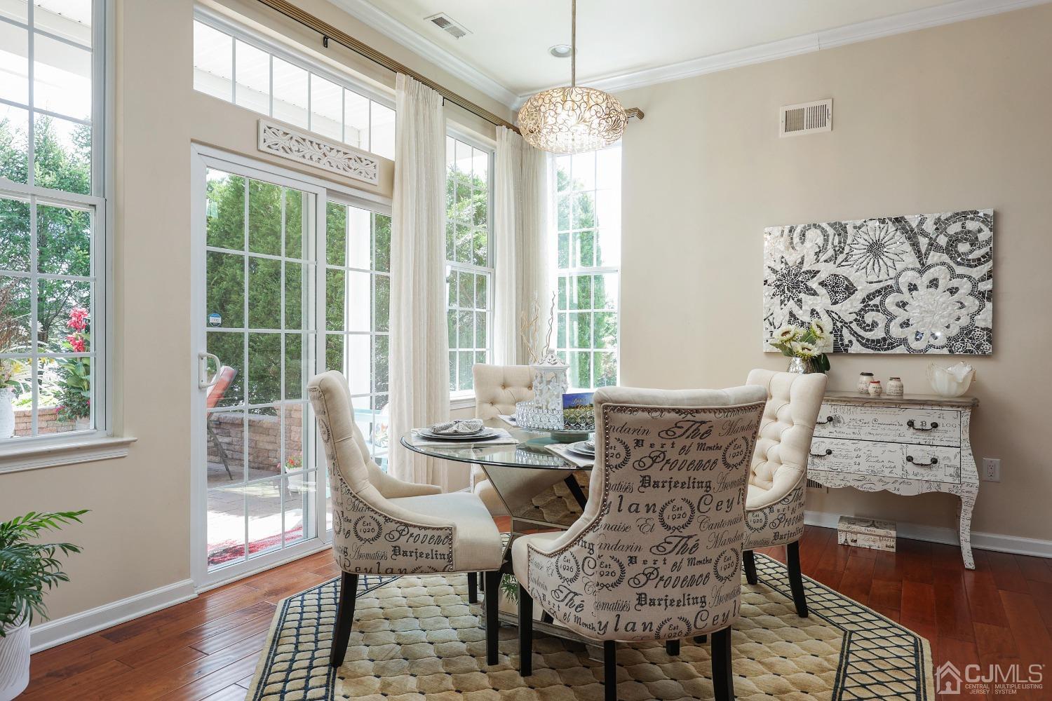 170 Tournament Drive Monroe Township, NJ 08831 - Photo 17 of 36 a view of a dining room with furniture window and wooden floor