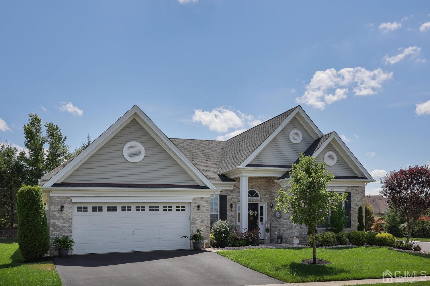 170 Tournament Drive Monroe Township, NJ 08831 - Photo 2 of 36 a view of a house with a yard and a garage