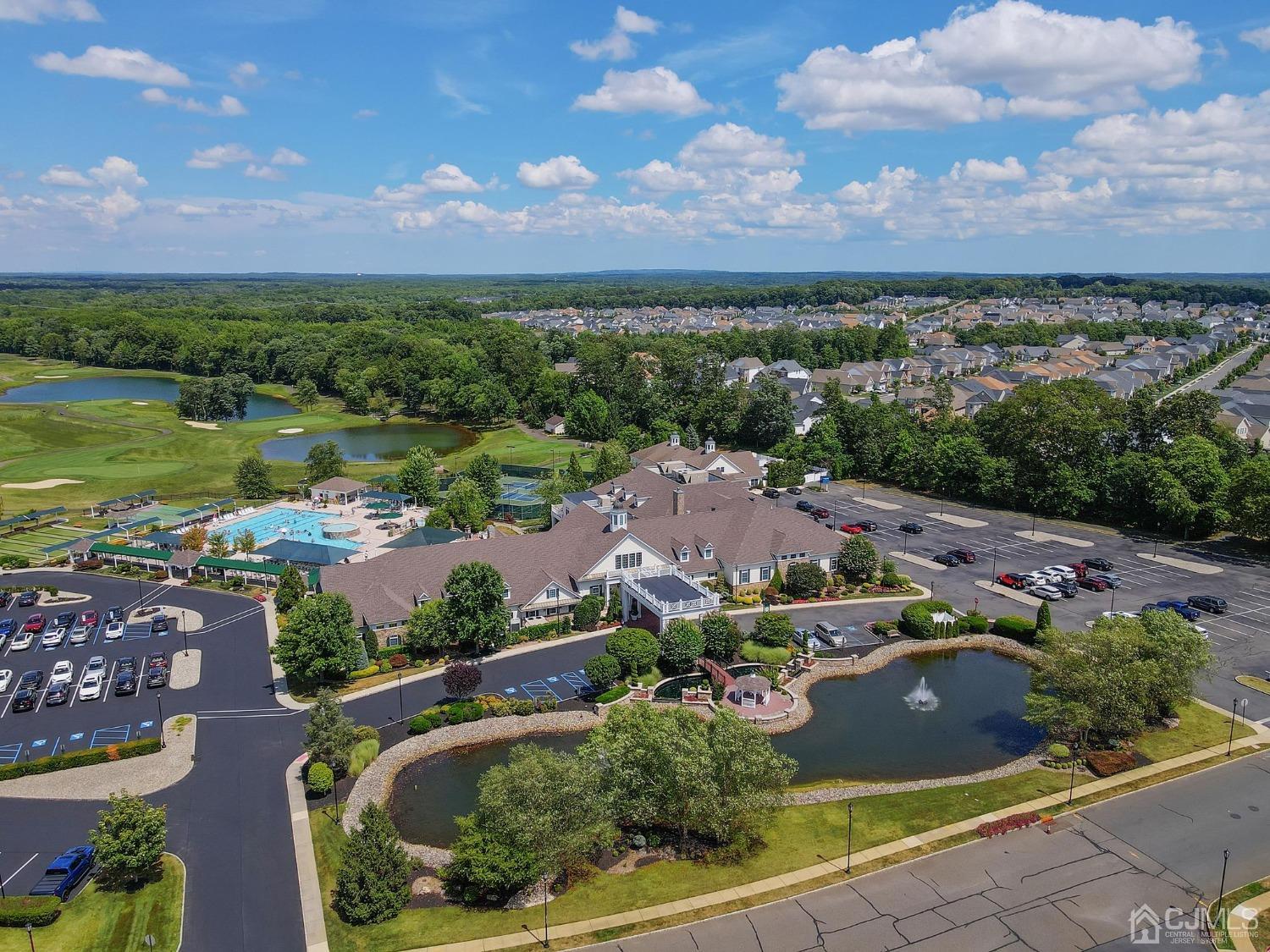 170 Tournament Drive Monroe Township, NJ 08831 - Photo 34 of 36 an aerial view of lake and residential houses with outdoor space