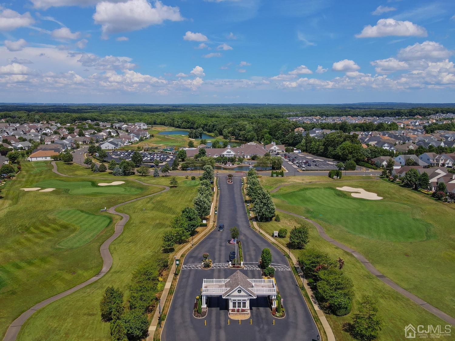 170 Tournament Drive Monroe Township, NJ 08831 - Photo 35 of 36 a view of a lake with a building in the background