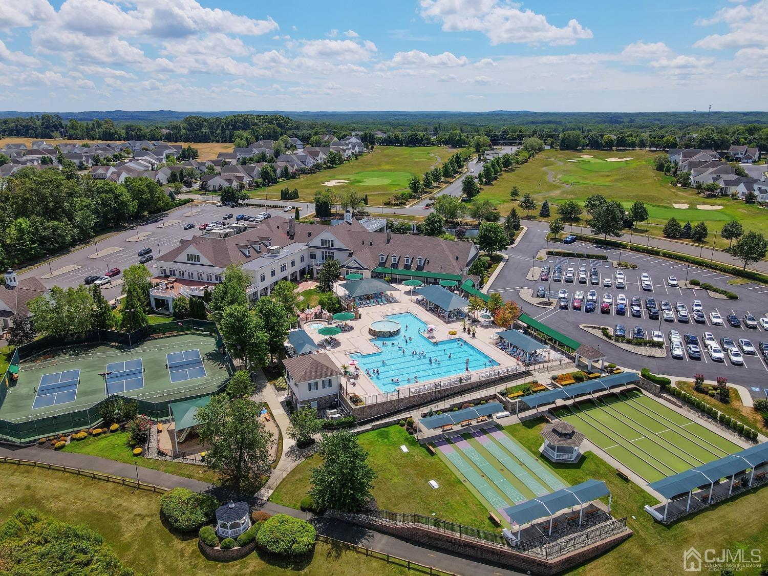 170 Tournament Drive Monroe Township, NJ 08831 - Photo 36 of 36 an aerial view of a pool and an outdoor seating