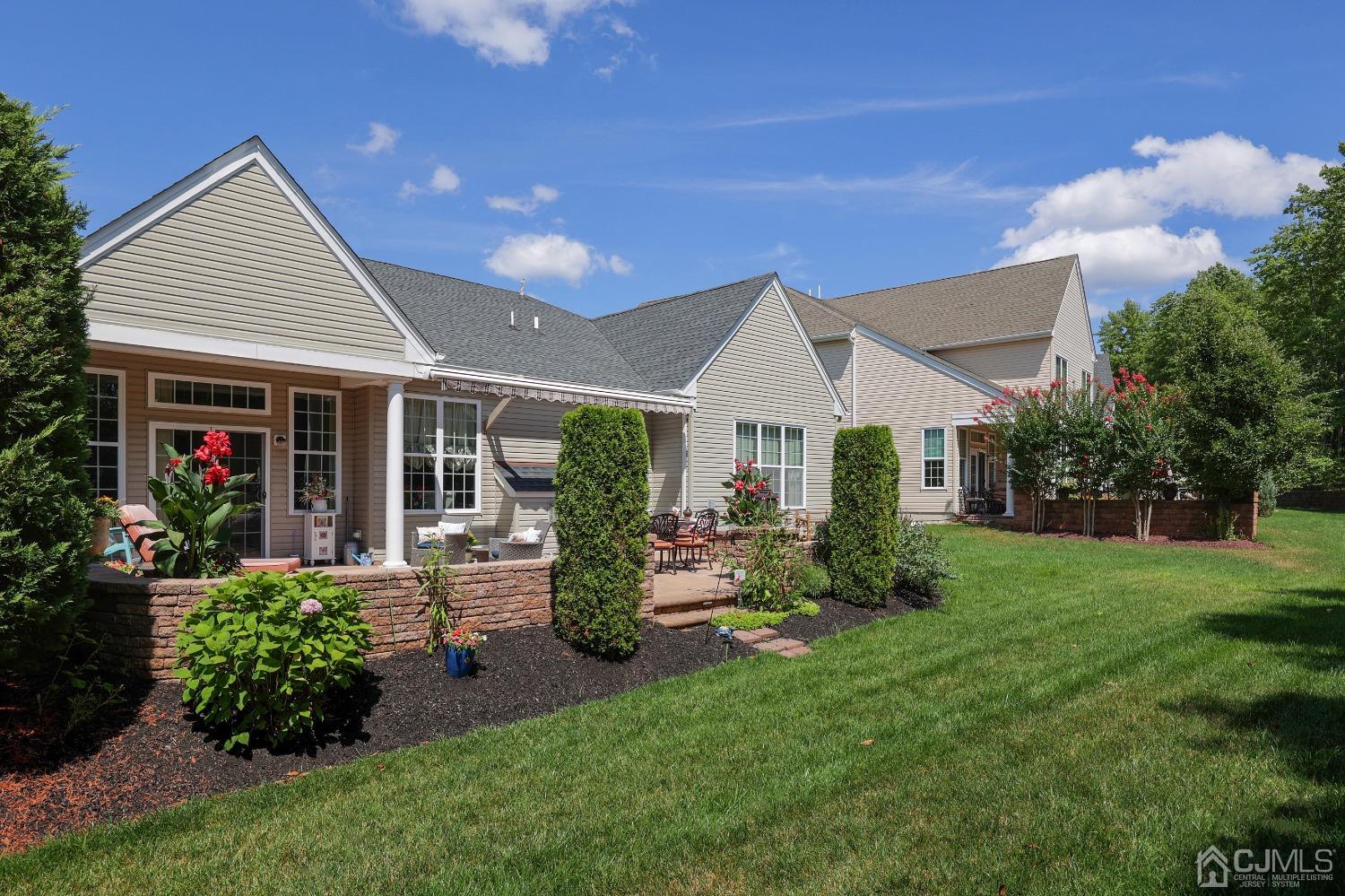 170 Tournament Drive Monroe Township, NJ 08831 - Photo 7 of 36 a front view of a house with garden and porch