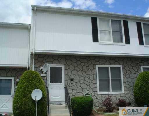6606 Hana Road Edison, NJ 08817 - Photo 1 of 8 a front view of a house with plants