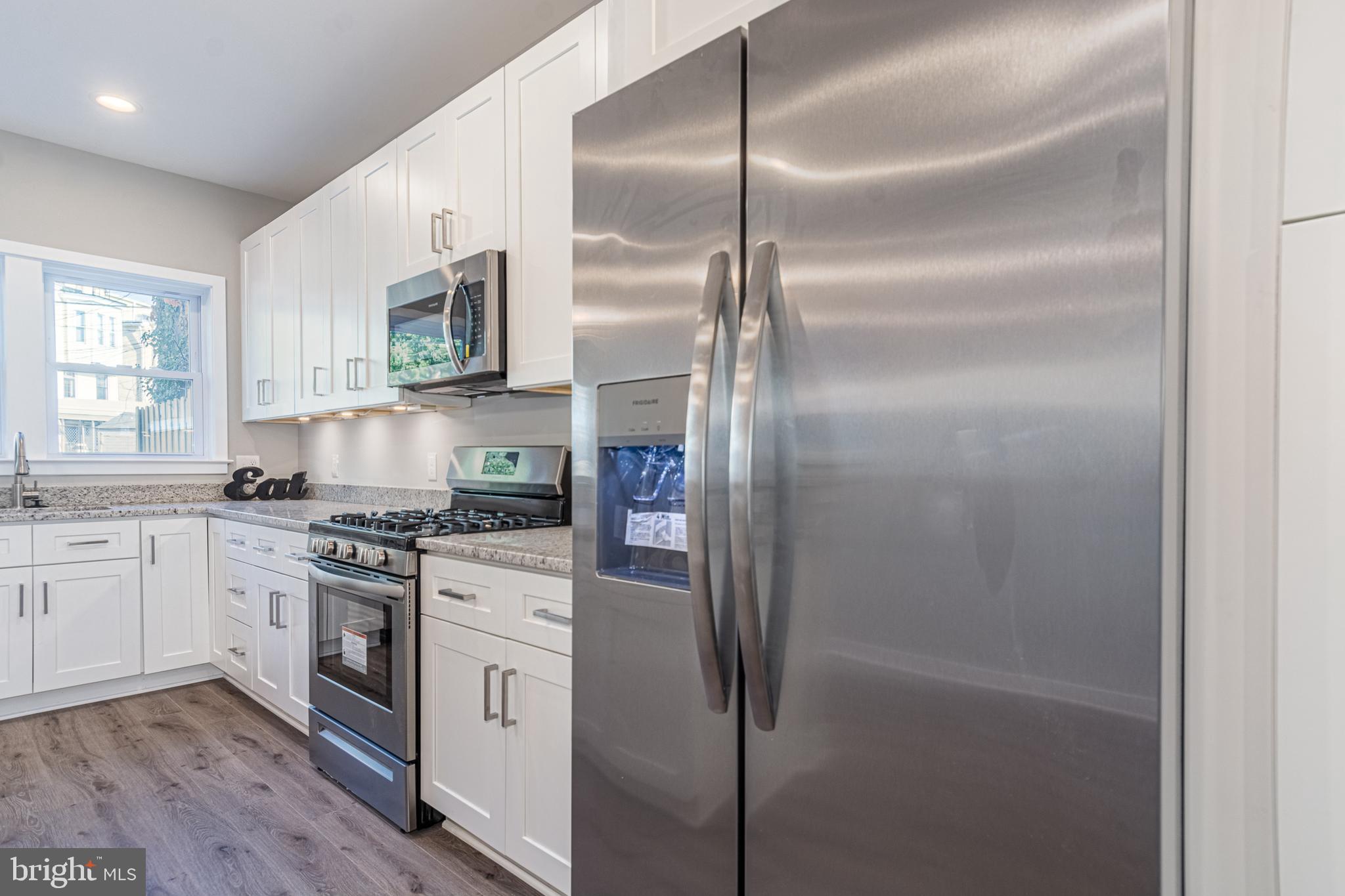 846 Edmondson Avenue Baltimore, MD 21201 - Photo 15 of 43 a kitchen with cabinets and a stove