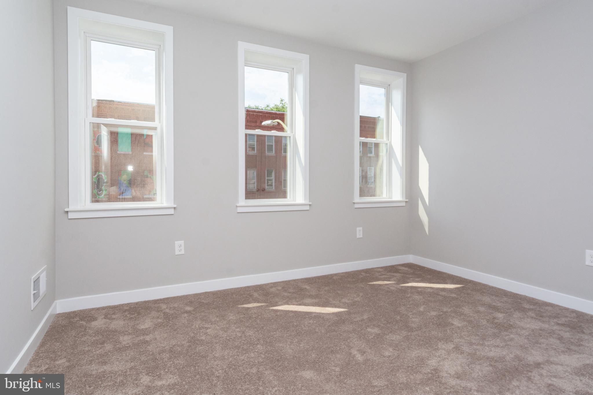 846 Edmondson Avenue Baltimore, MD 21201 - Photo 17 of 43 a view of empty room with windows