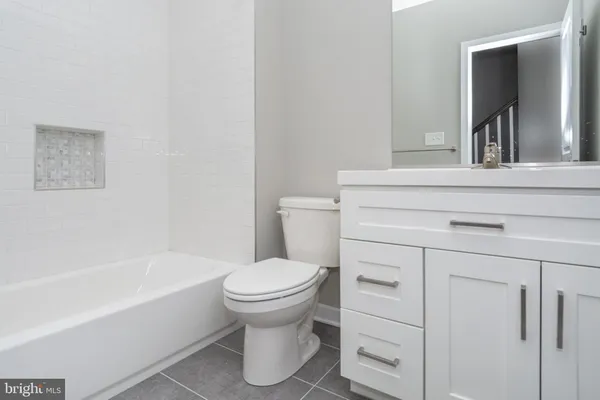 a bathroom with a sink toilet and a bathtub