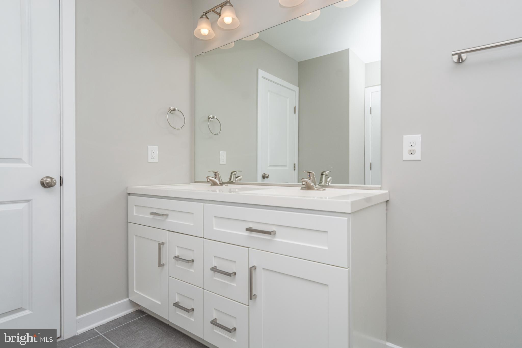 846 Edmondson Avenue Baltimore, MD 21201 - Photo 25 of 43 a bathroom with a sink and a mirror