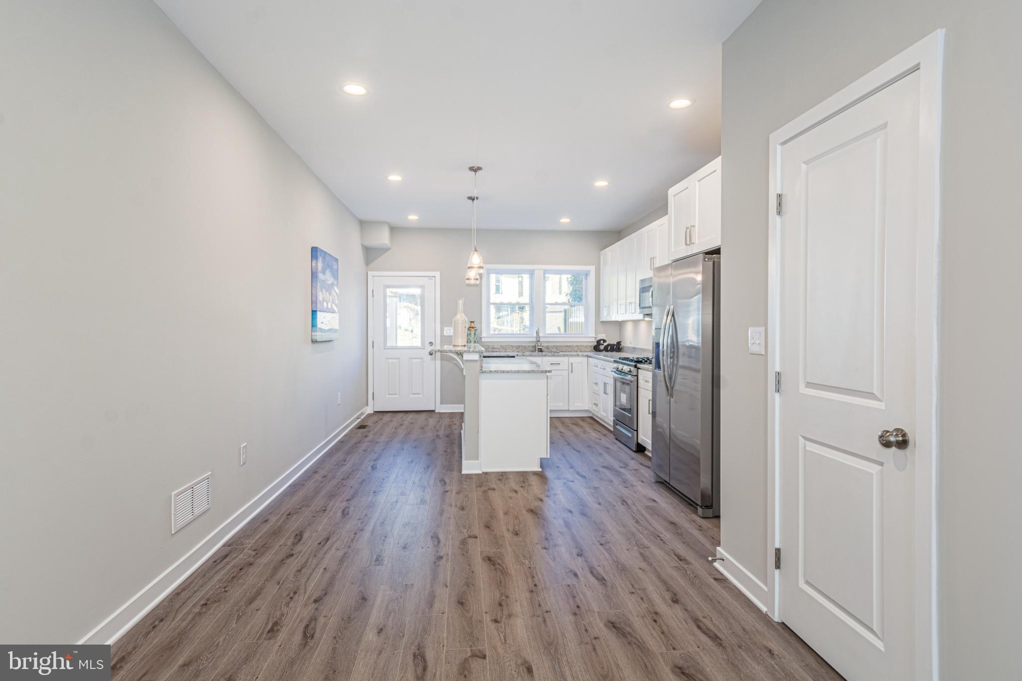 846 Edmondson Avenue Baltimore, MD 21201 - Photo 8 of 43 a view of a kitchen with wooden floor