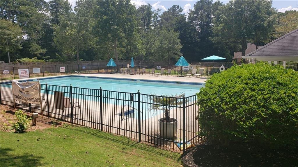3920 Knotts Pass Road Southwest Snellville, GA 30039 - Photo 17 of 19 a view of a wrought iron fences in front of house
