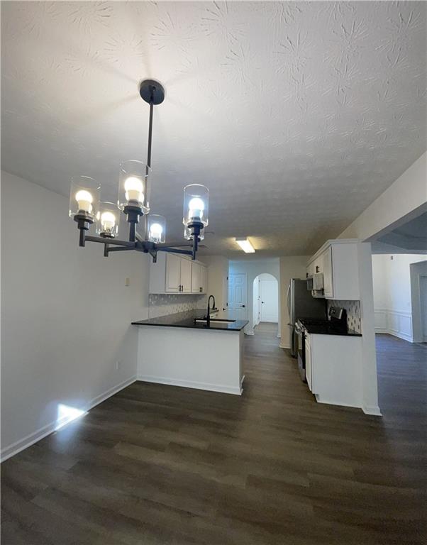 3920 Knotts Pass Road Southwest Snellville, GA 30039 - Photo 4 of 19 a view of a kitchen with a chandelier