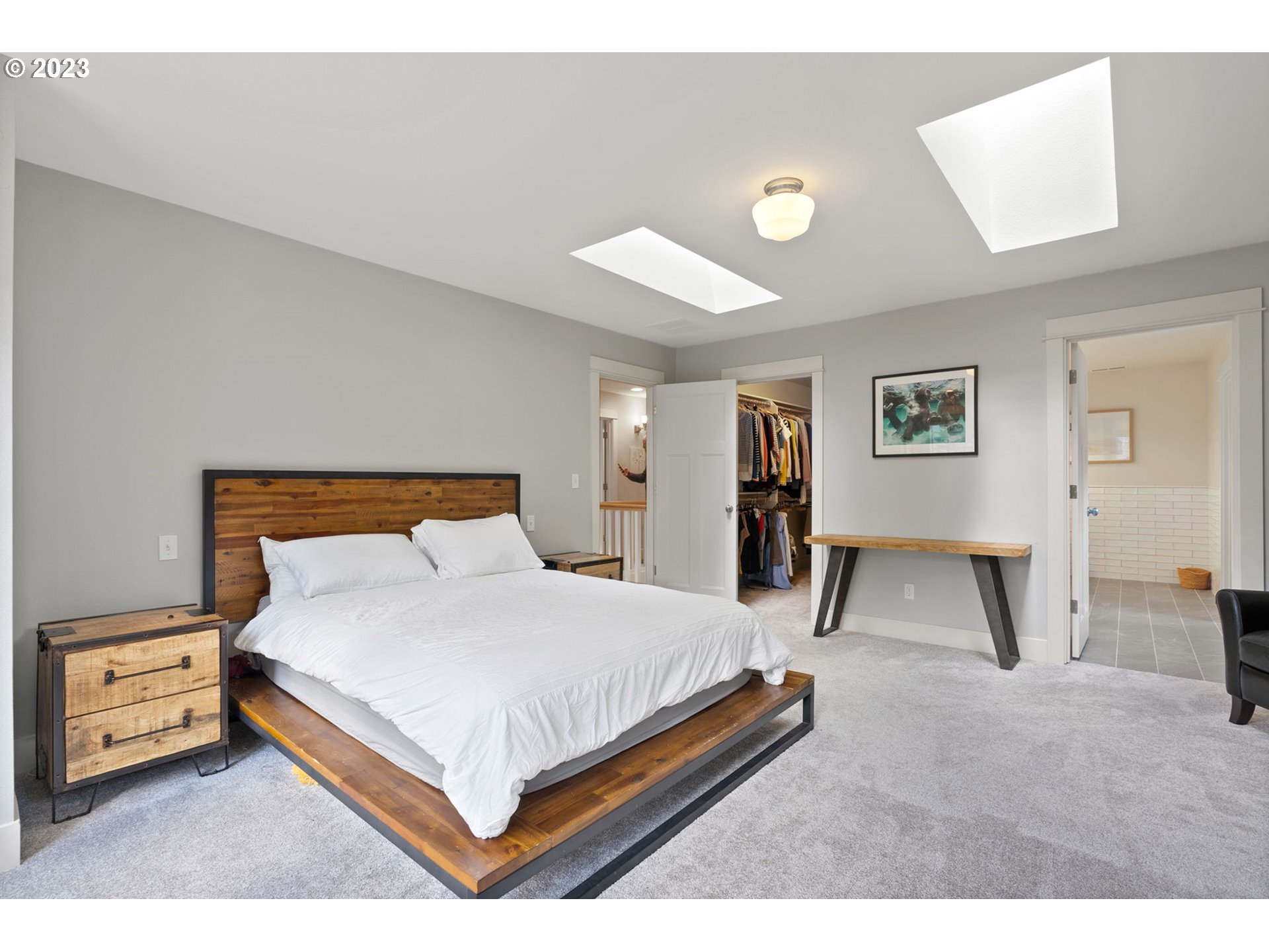 2126 Northwest 32nd Avenue Portland, OR 97210 - Photo 20 of 48 a bedroom with a bed and a lamp