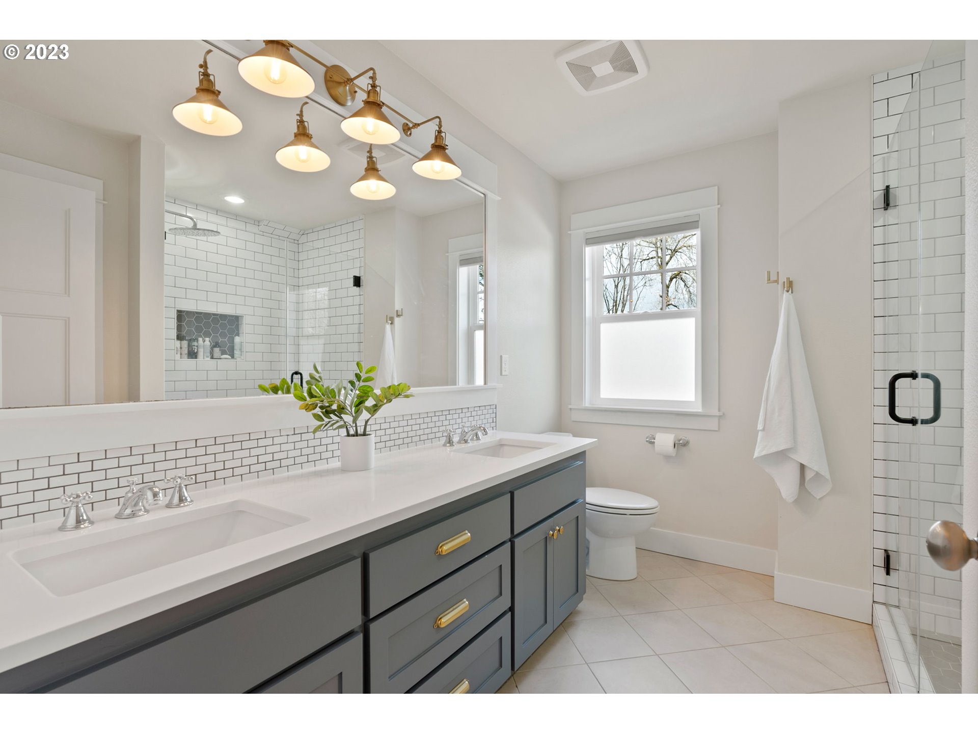 2126 Northwest 32nd Avenue Portland, OR 97210 - Photo 28 of 48 a bathroom with a sink a vanity and a mirror