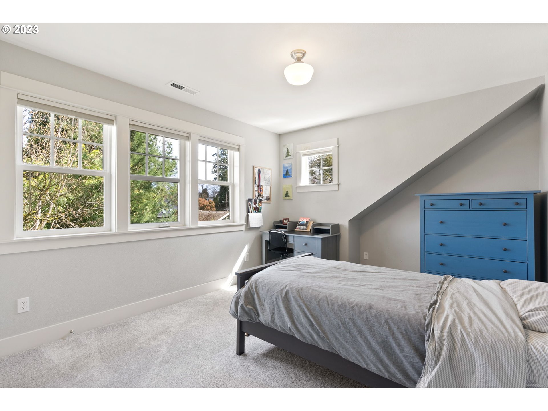 2126 Northwest 32nd Avenue Portland, OR 97210 - Photo 29 of 48 a bedroom with a bed and a window