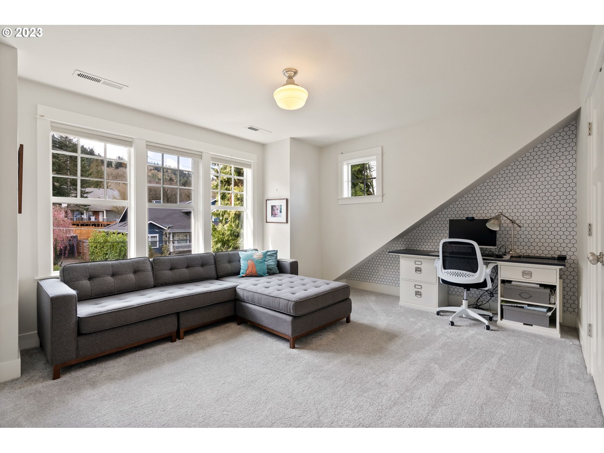 2126 Northwest 32nd Avenue Portland, OR 97210 - Photo 30 of 48 a living room with furniture and a window