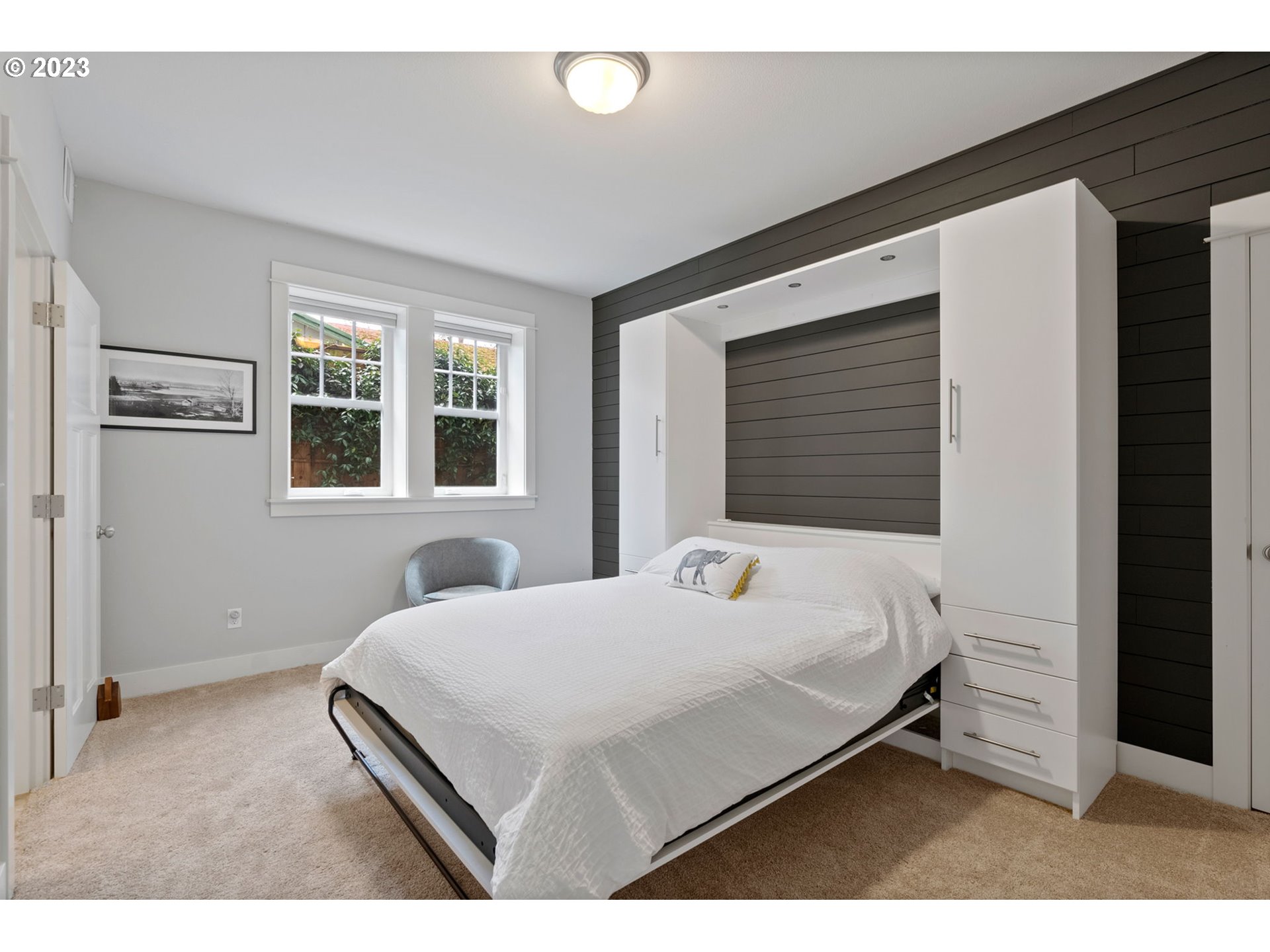 2126 Northwest 32nd Avenue Portland, OR 97210 - Photo 36 of 48 a bedroom with a bed and a window