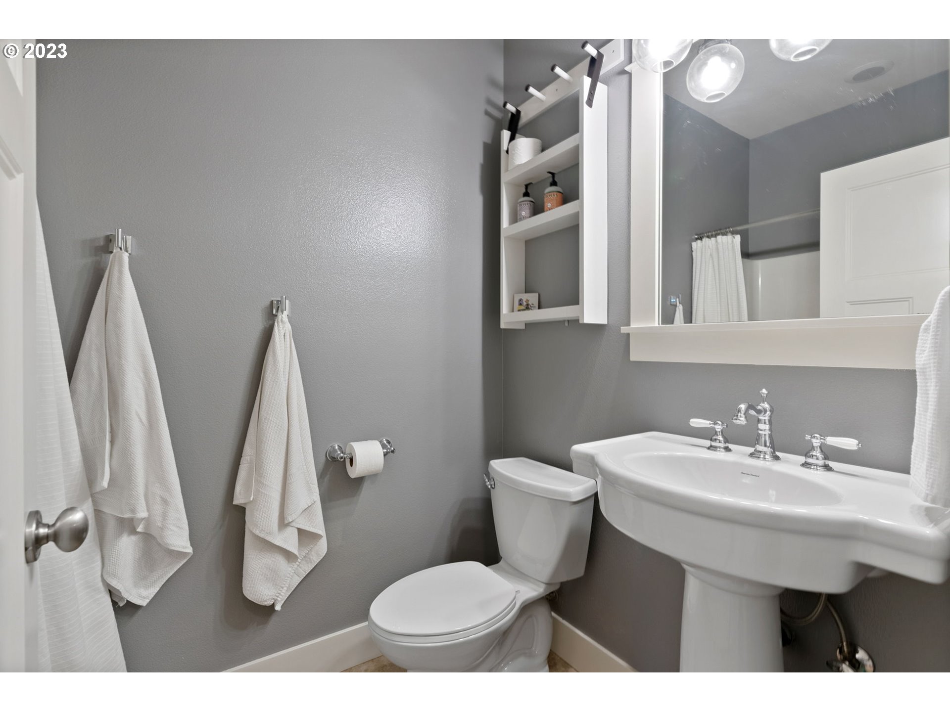 2126 Northwest 32nd Avenue Portland, OR 97210 - Photo 38 of 48 a bathroom with a sink toilet and a mirror