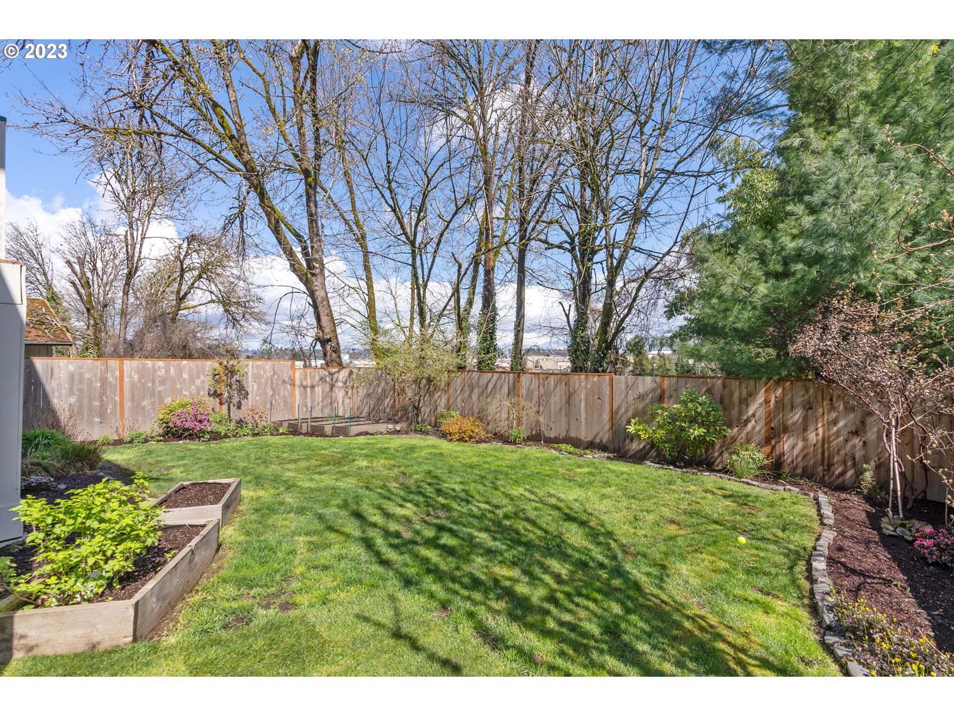 2126 Northwest 32nd Avenue Portland, OR 97210 - Photo 42 of 48 a view of a backyard with large trees