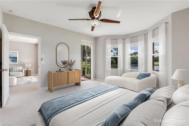 a bedroom with furniture or bathtub and a large window