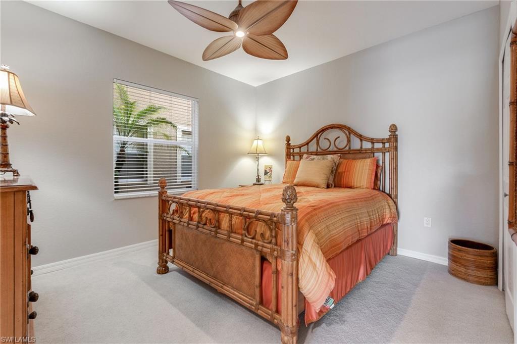 20031 Seagrove Street, Unit 1403 Estero, FL 33928 - Photo 16 of 28 a bedroom with a bed and window