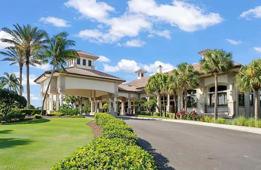 20031 Seagrove Street, Unit 1403 Estero, FL 33928 - Photo 25 of 28 a view of a building with a yard