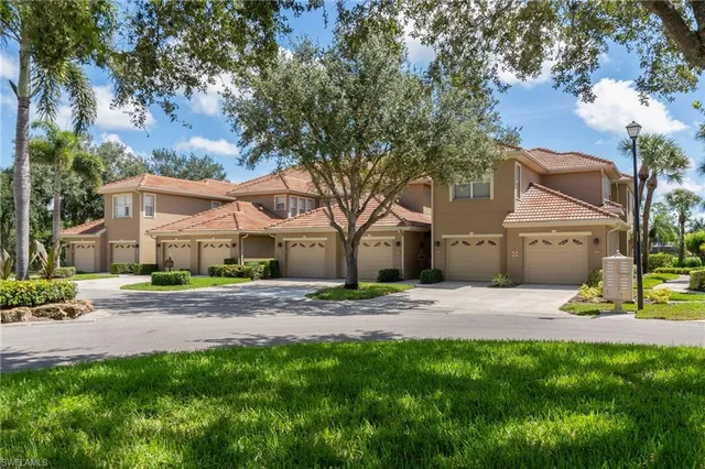 a small house with a tree in front of it