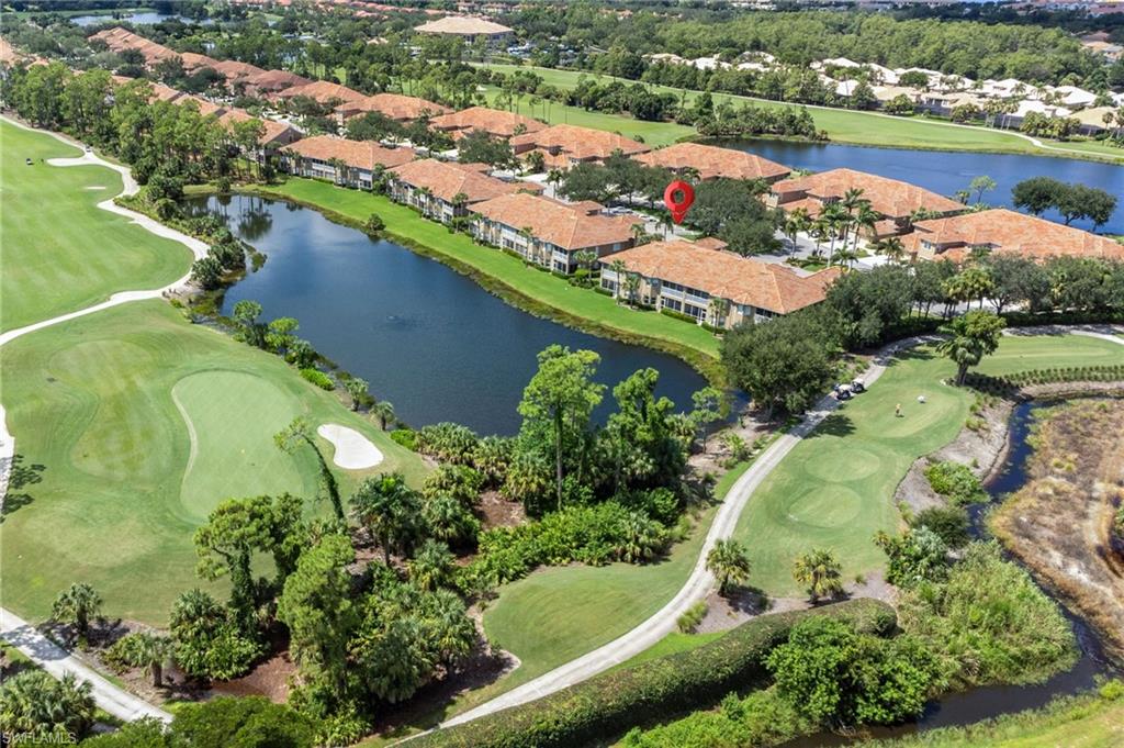 20031 Seagrove Street, Unit 1403 Estero, FL 33928 - Photo 4 of 28 an aerial view of lake residential houses with outdoor space and lake view