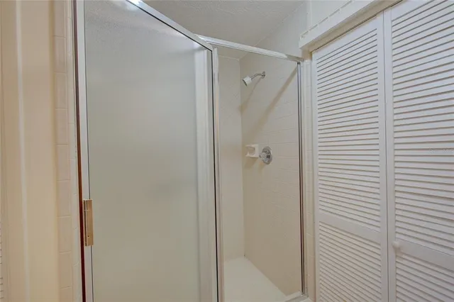 a bathroom with a shower and a tub