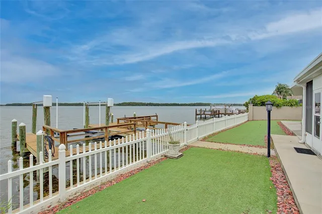 a view of a balcony with yard