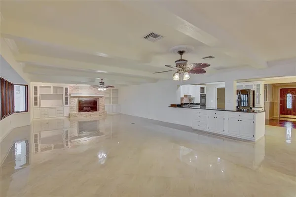 a view of a livingroom with a kitchen