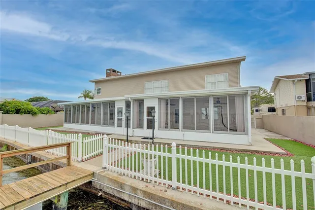 a view of a house with a wooden deck