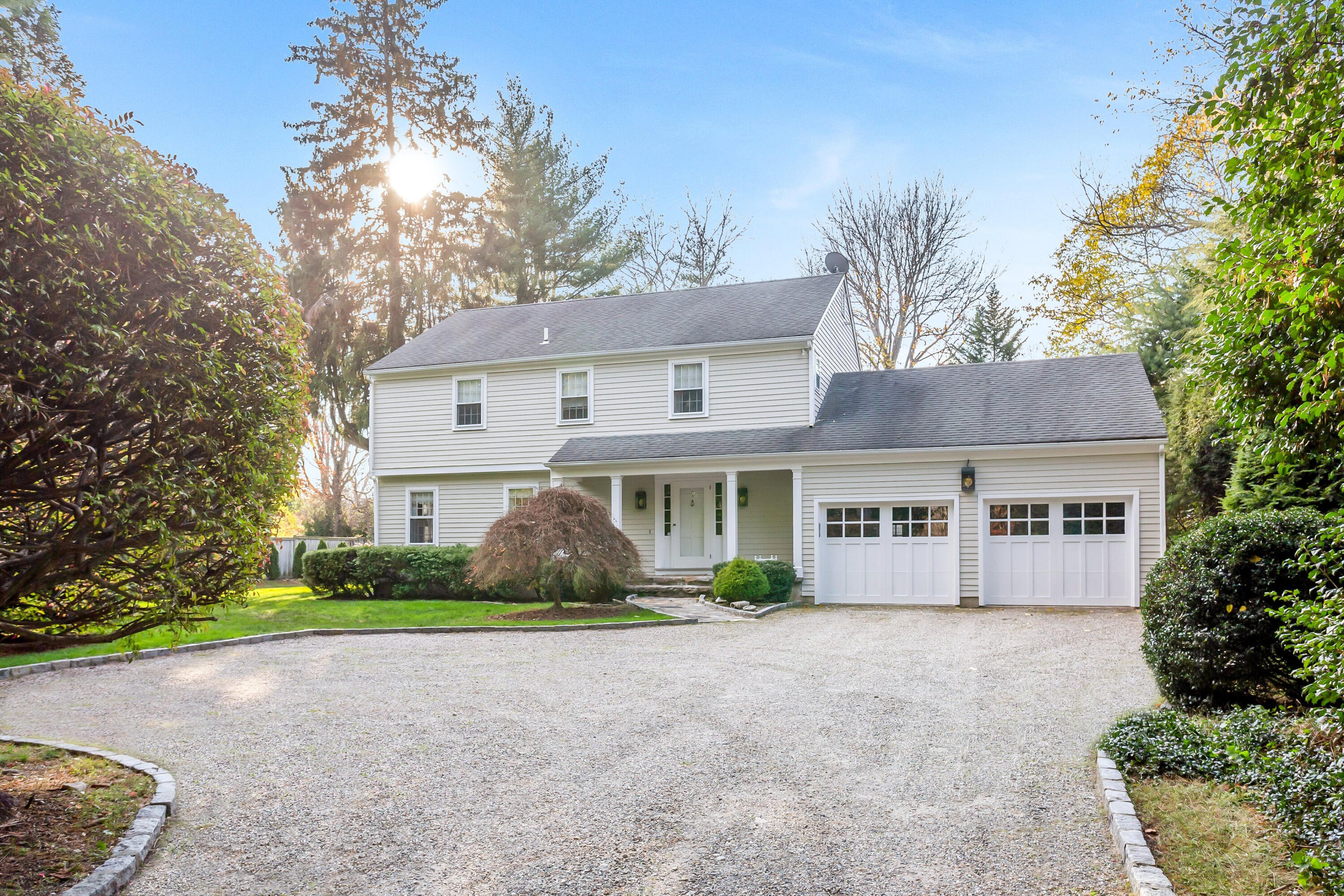 9 Peterick Lane Darien, CT 06820 - Photo 1 of 28 a front view of house with yard and green space