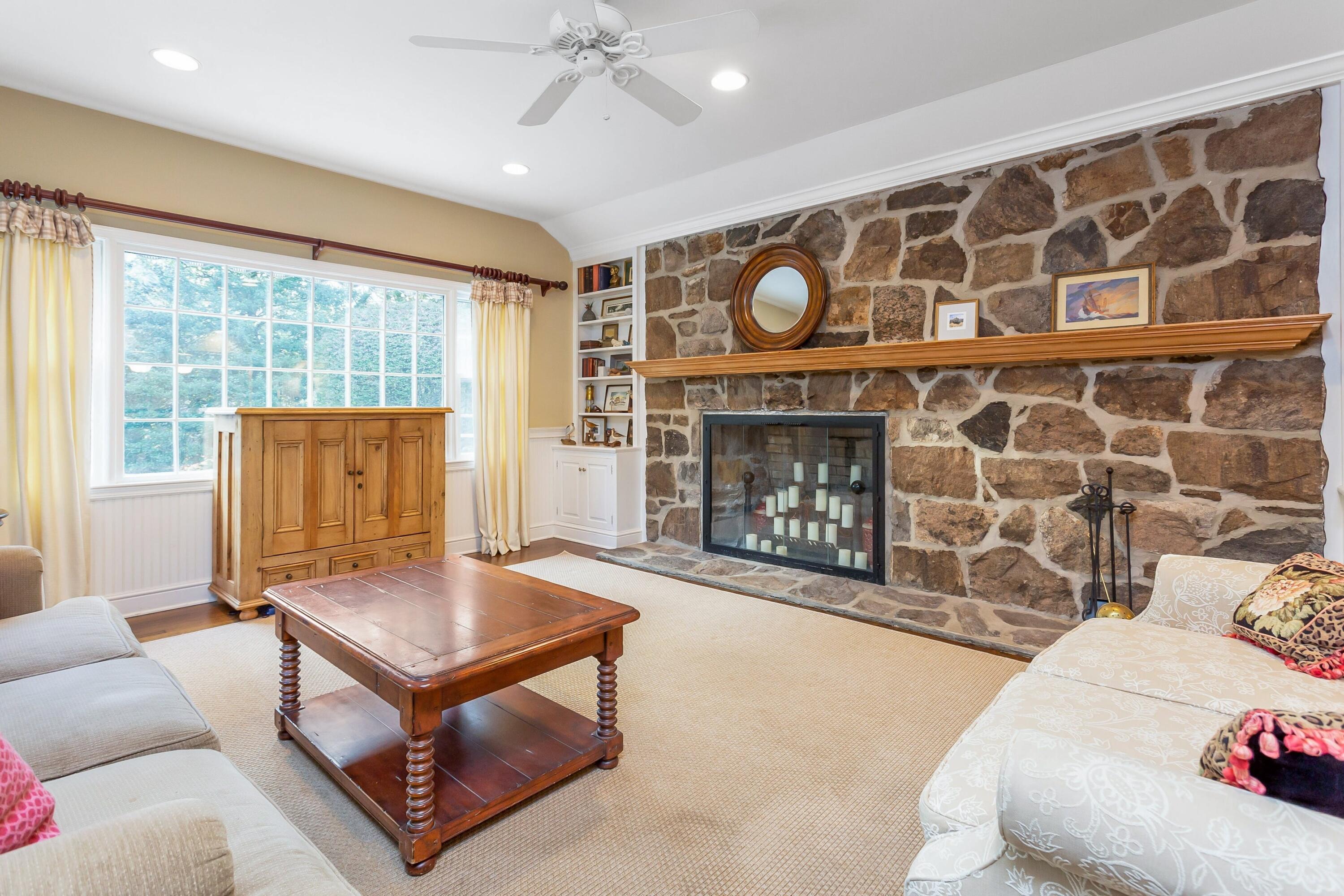 9 Peterick Lane Darien, CT 06820 - Photo 11 of 28 a living room with furniture and a fireplace
