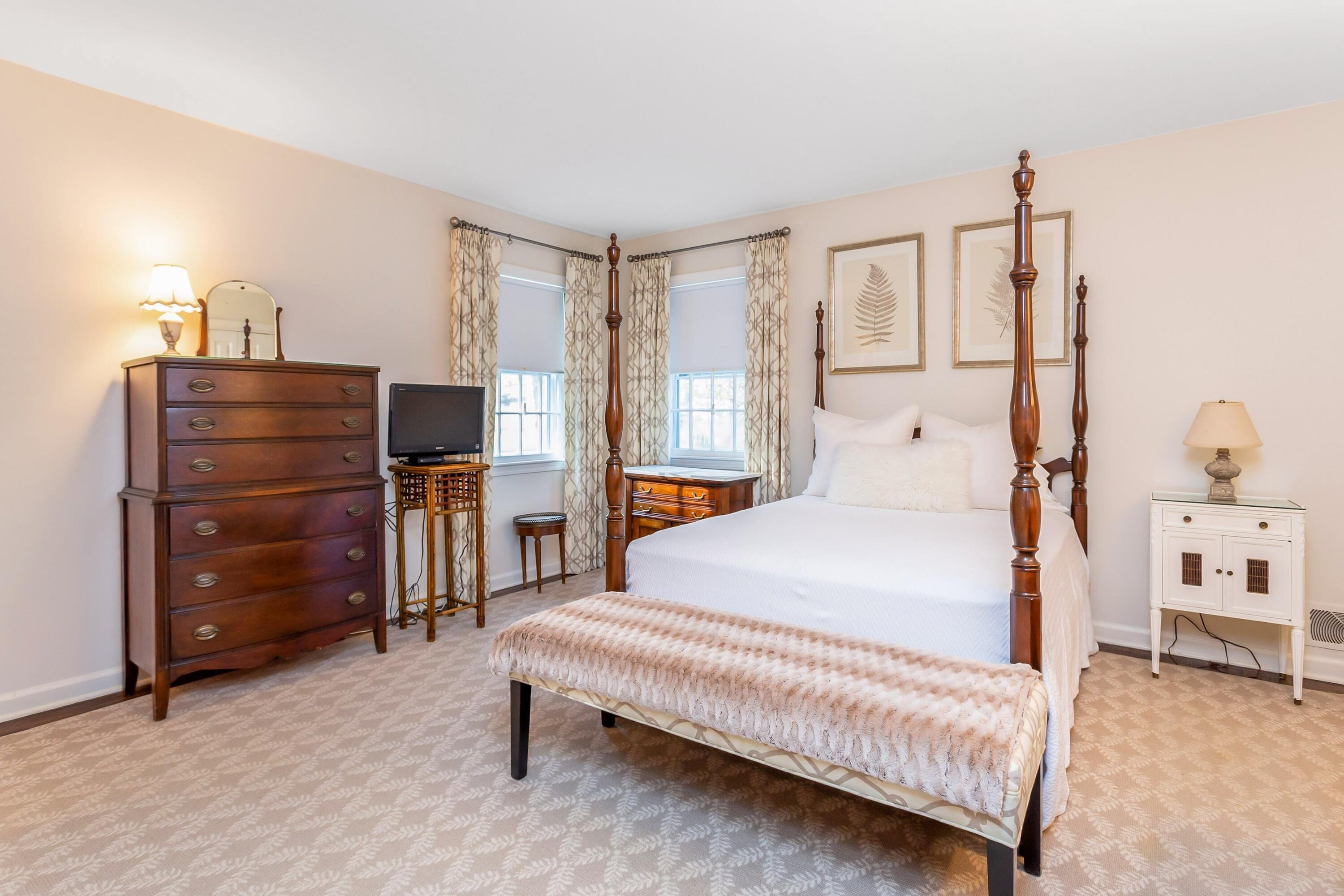 9 Peterick Lane Darien, CT 06820 - Photo 19 of 28 a bedroom with a bed and a cabinets