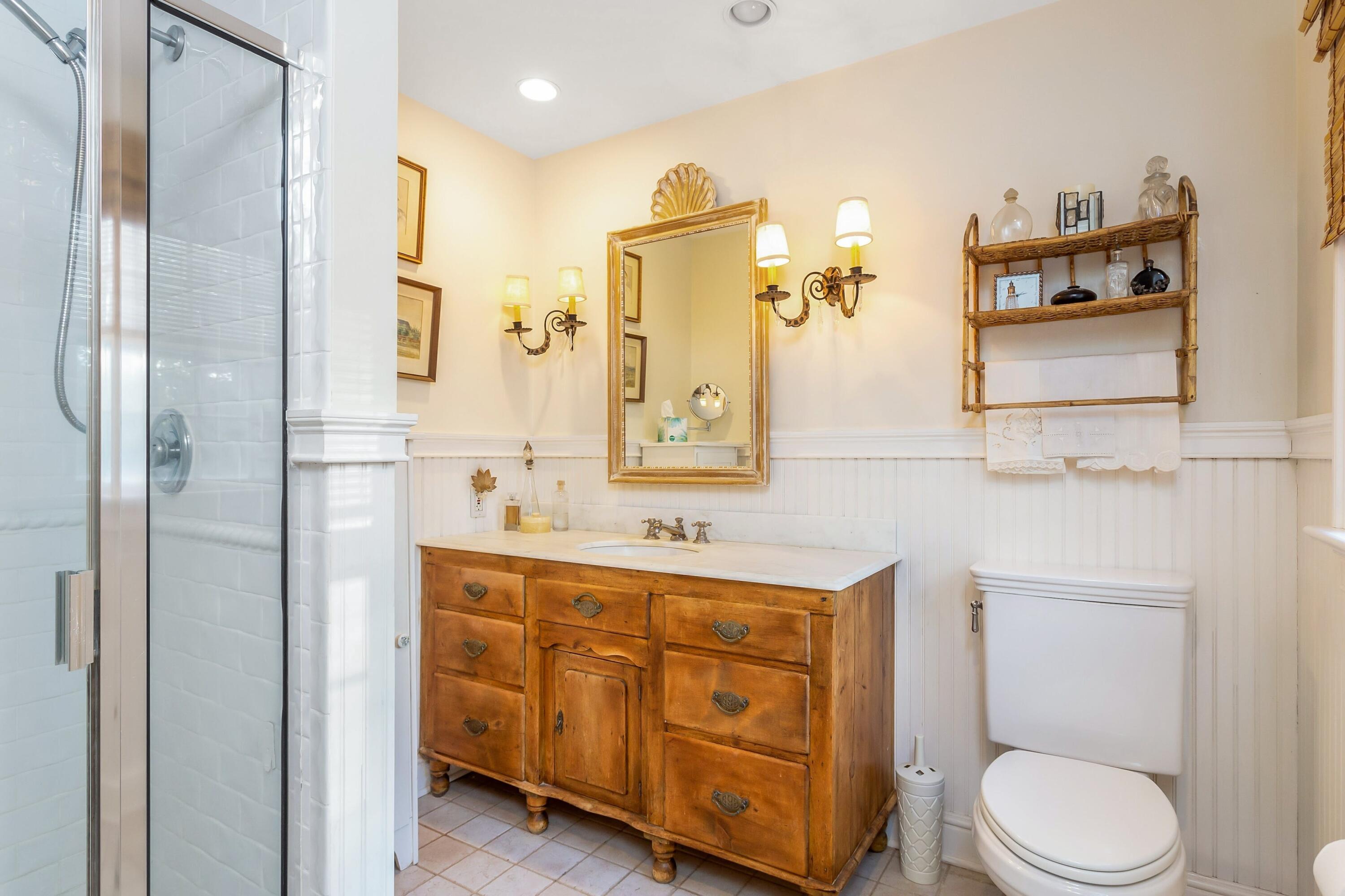 9 Peterick Lane Darien, CT 06820 - Photo 20 of 28 a bathroom with a toilet sink and mirror