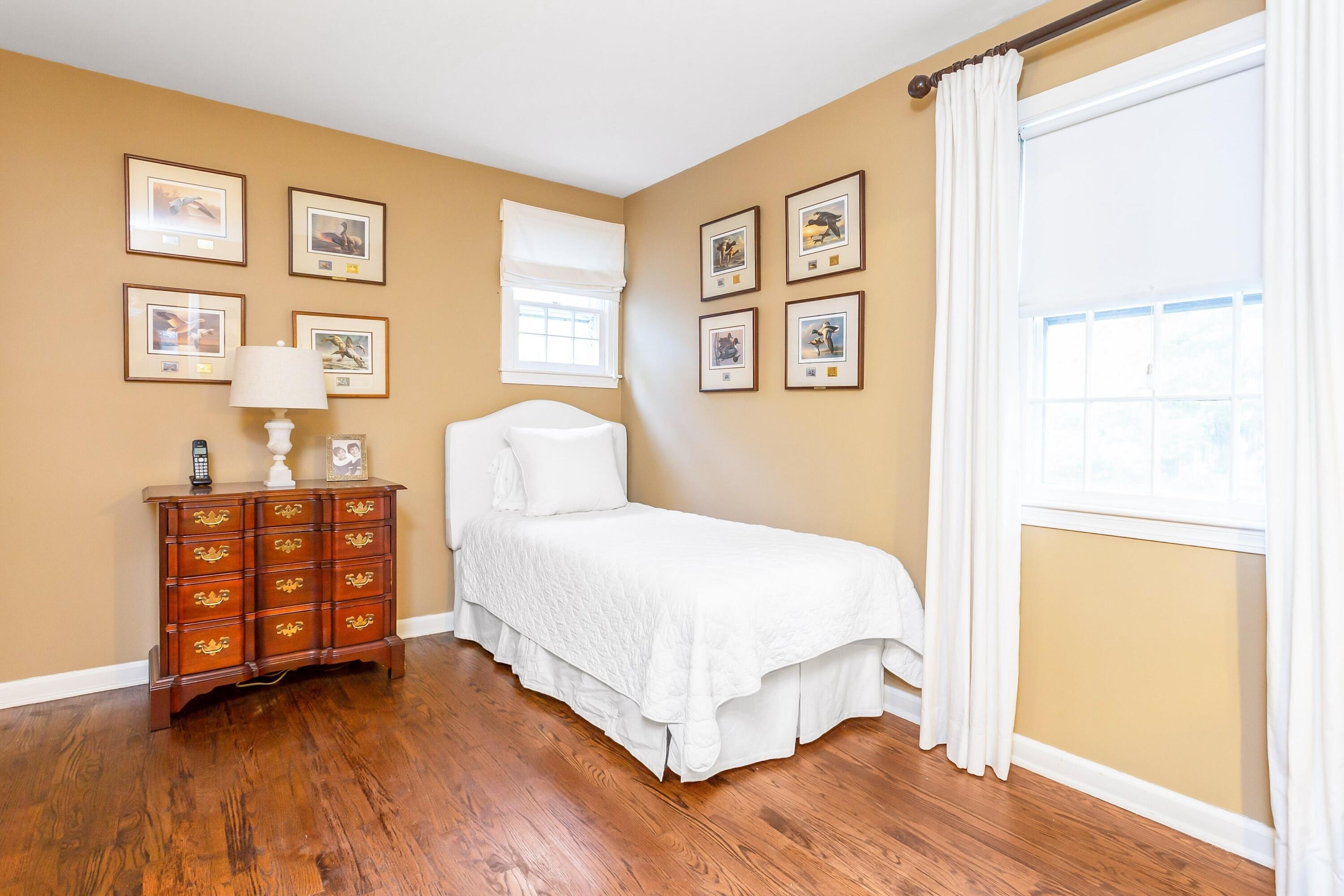 9 Peterick Lane Darien, CT 06820 - Photo 22 of 28 a bedroom with a bed and a window