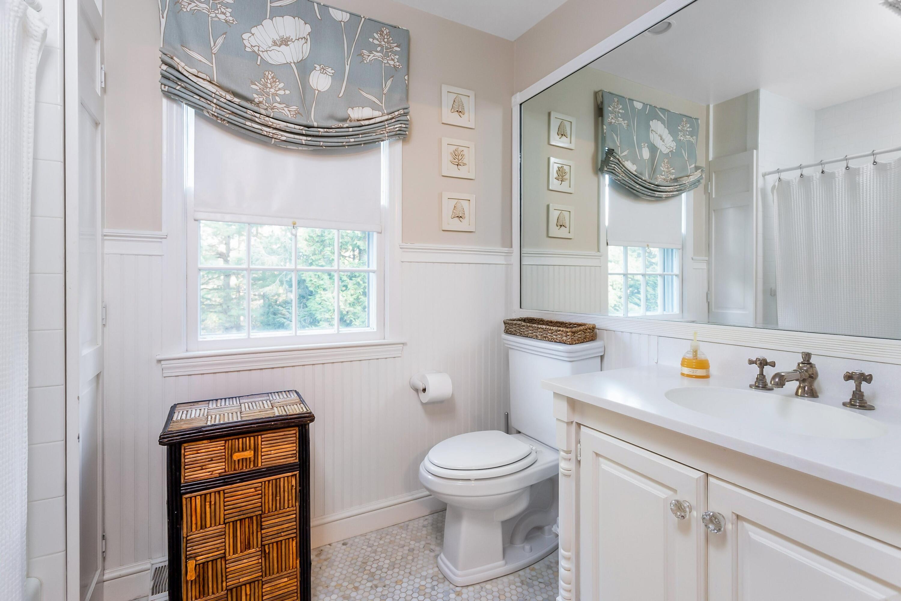 9 Peterick Lane Darien, CT 06820 - Photo 24 of 28 a bathroom with a sink a toilet and a window