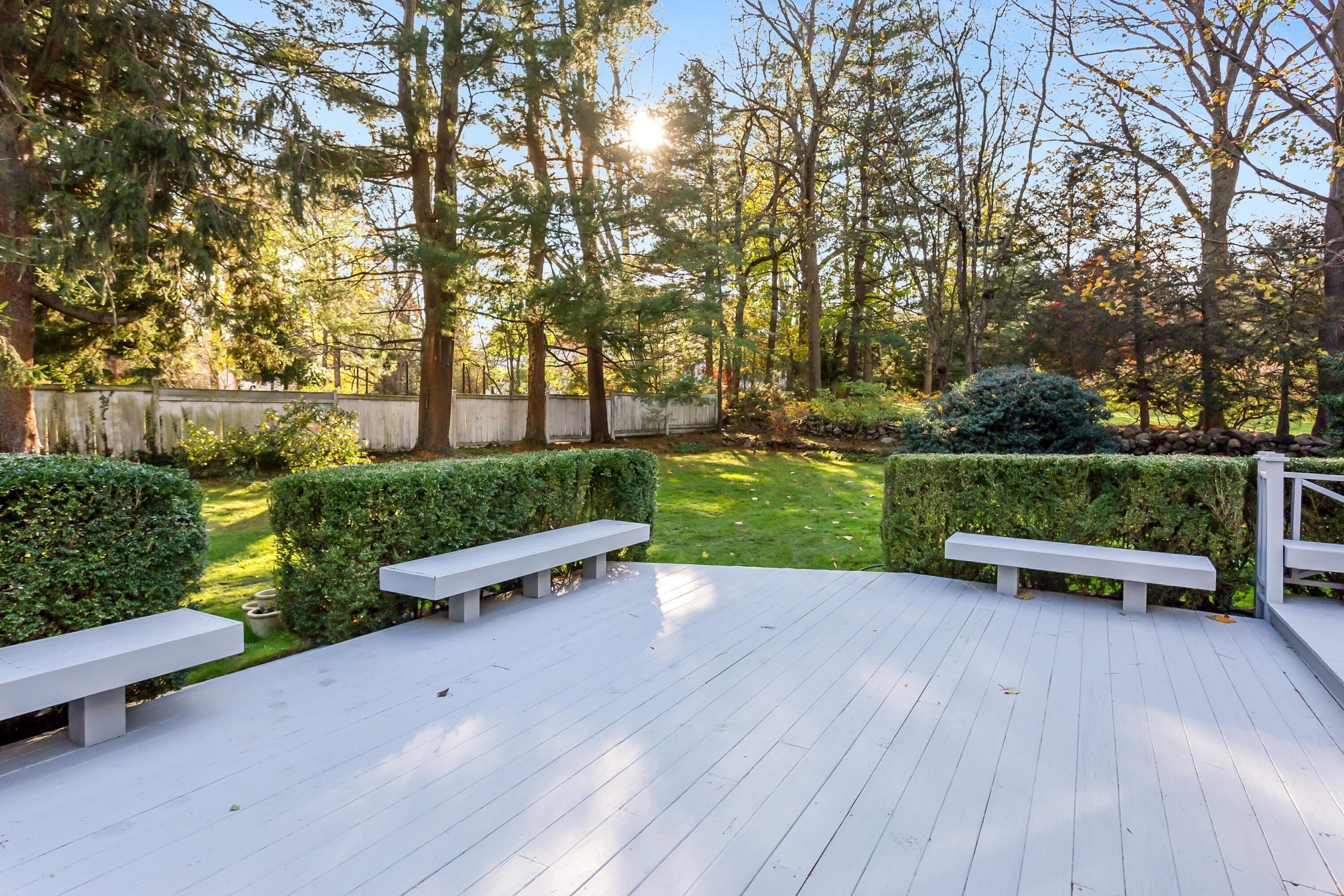9 Peterick Lane Darien, CT 06820 - Photo 27 of 28 a view of a bench in a garden