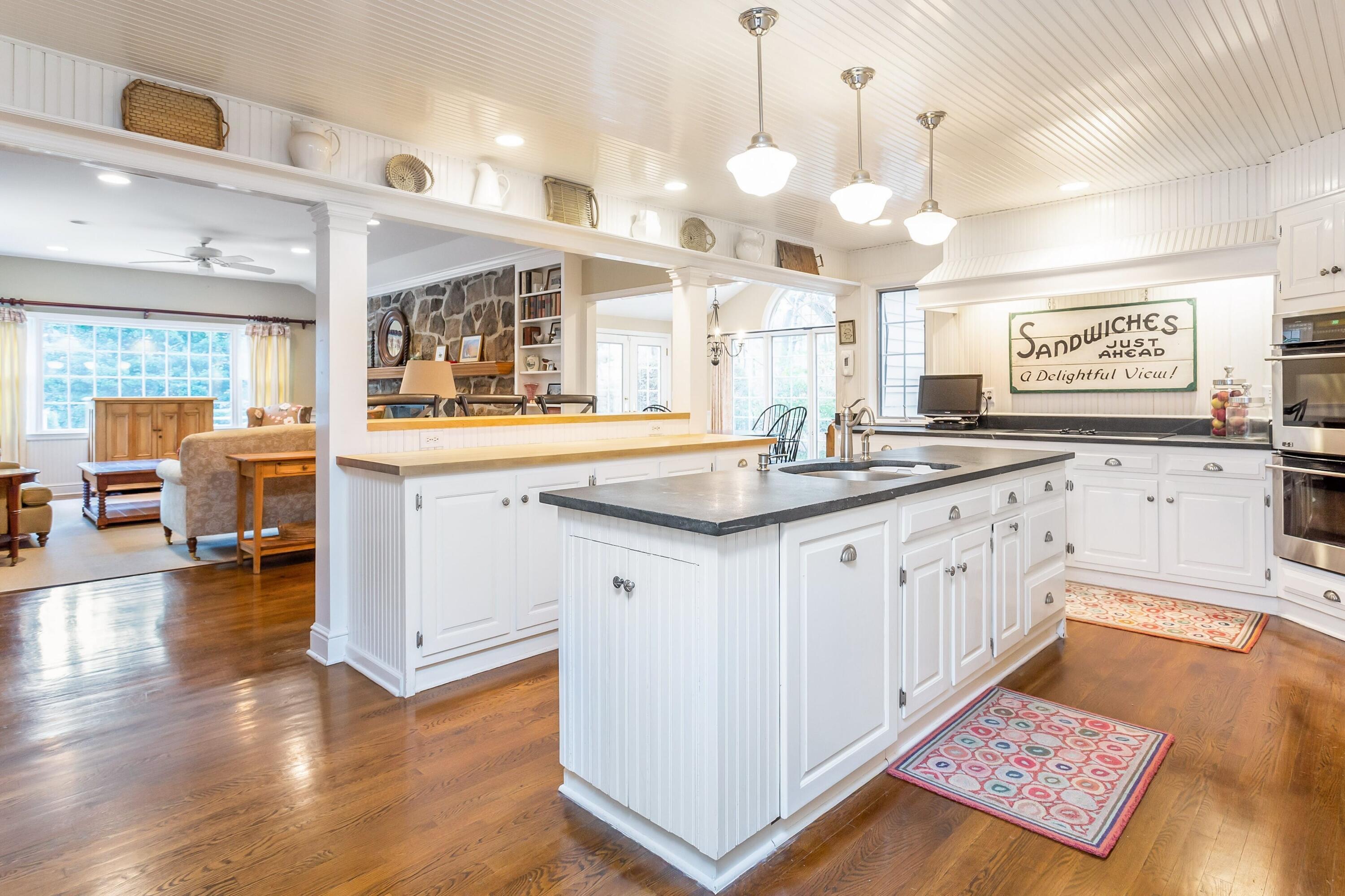 9 Peterick Lane Darien, CT 06820 - Photo 6 of 28 a large white kitchen with a large window