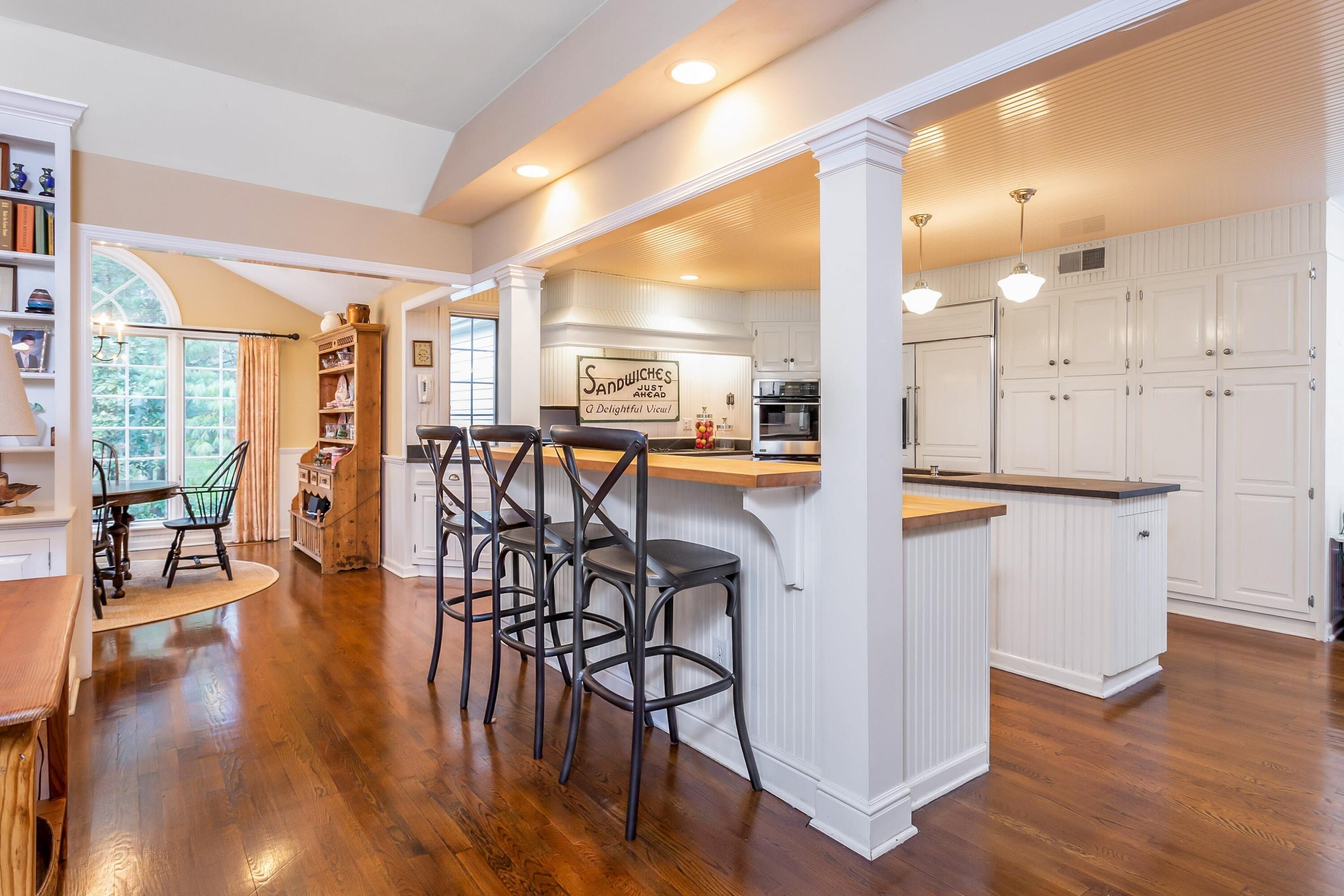 9 Peterick Lane Darien, CT 06820 - Photo 7 of 28 a view of a dining room with furniture and wooden floor