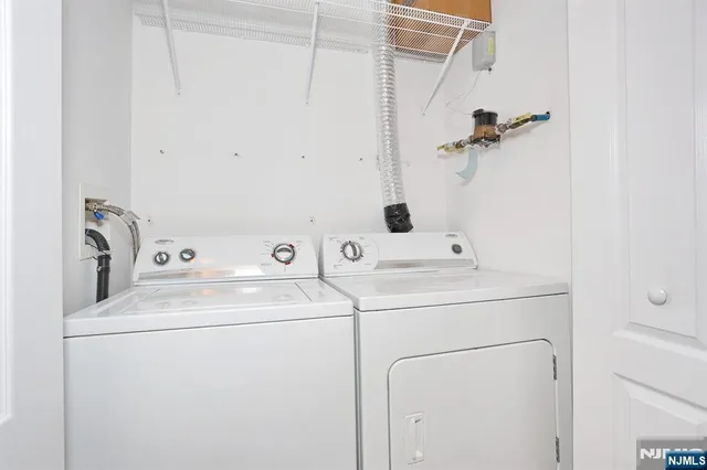 a room with pool table and windows