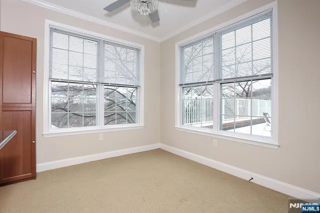 a view of a house with trees in the background