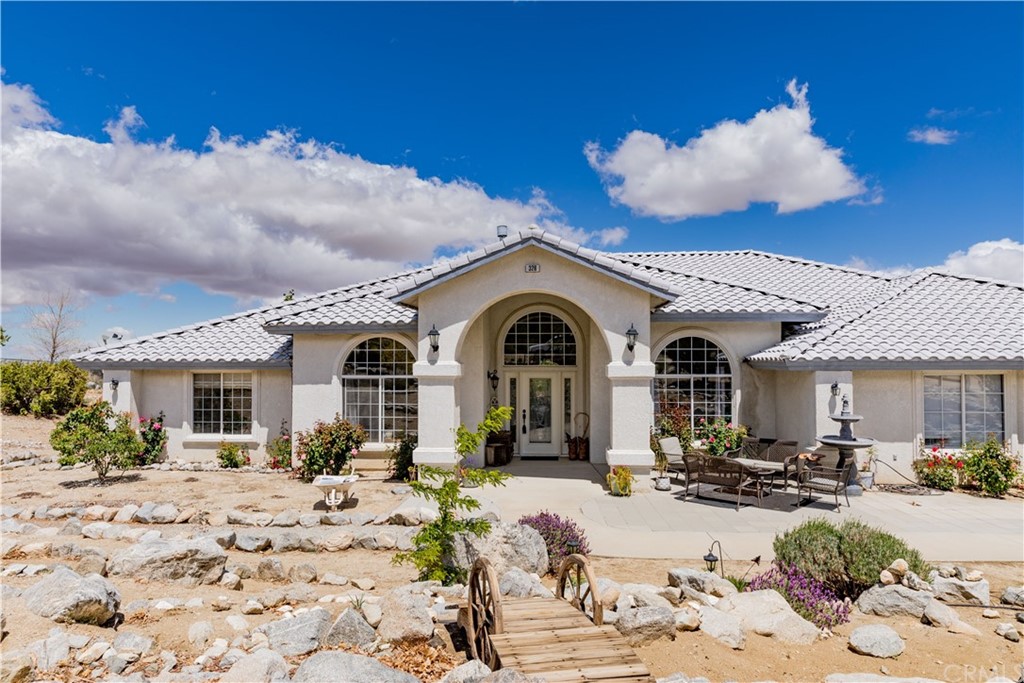 326 Ironwood Road Pinon Hills, CA 92372 - Photo 1 of 1 a view of a house with yard and sitting area