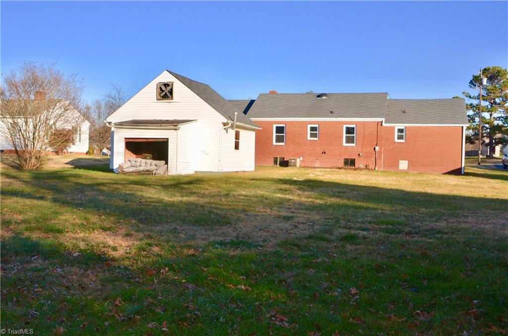 5818 Jones Road Walkertown, NC 27051 - Photo 5 of 49 Side view of large backyard to workshop & home (old couch to be removed!)