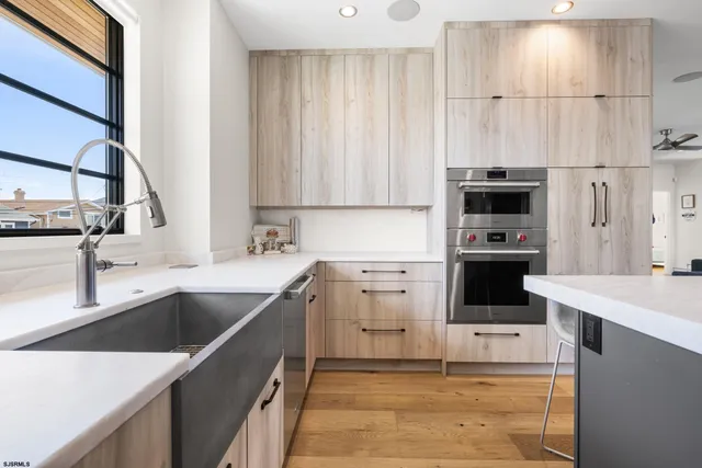 a living room with furniture a dining table and a flat screen tv