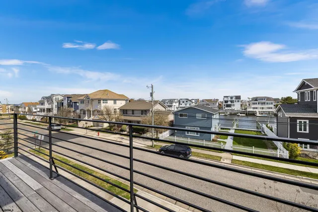 a room view with a large window and front door