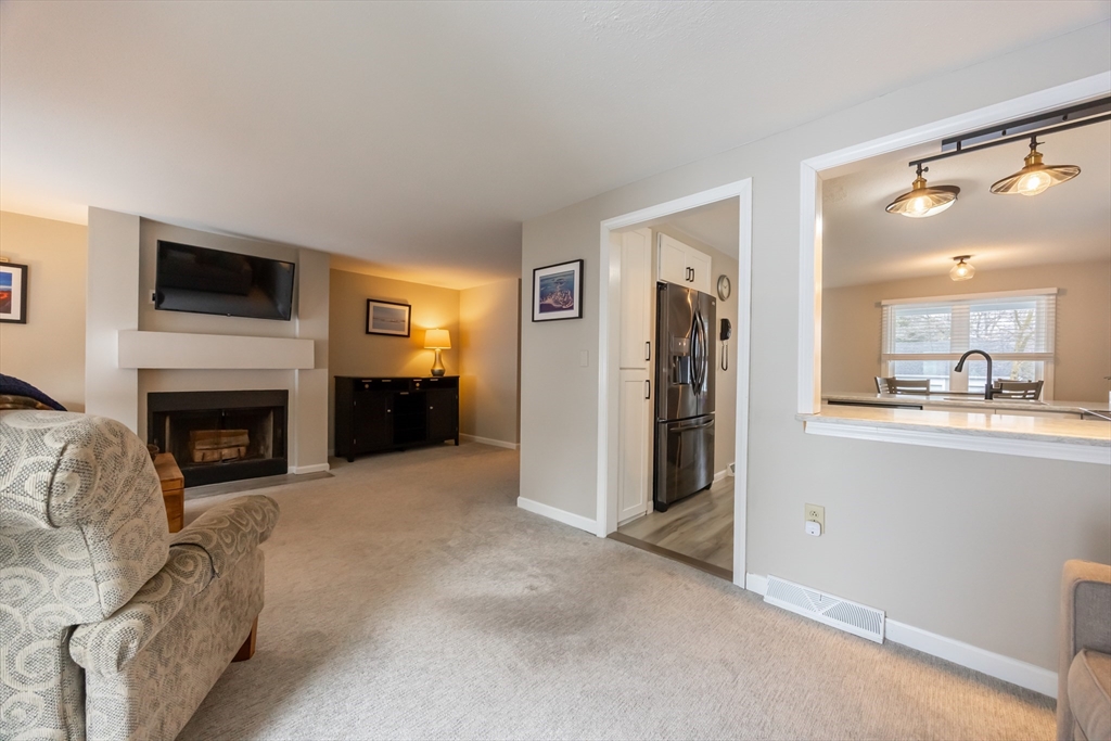 99 Stone Ridge Road, Unit 99 Franklin, MA 02038 - Photo 14 of 39 a view of a livingroom with a fireplace