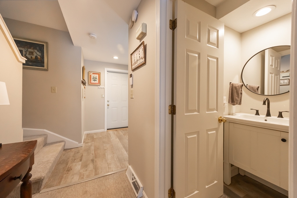 99 Stone Ridge Road, Unit 99 Franklin, MA 02038 - Photo 20 of 39 a bathroom with a sink and a mirror