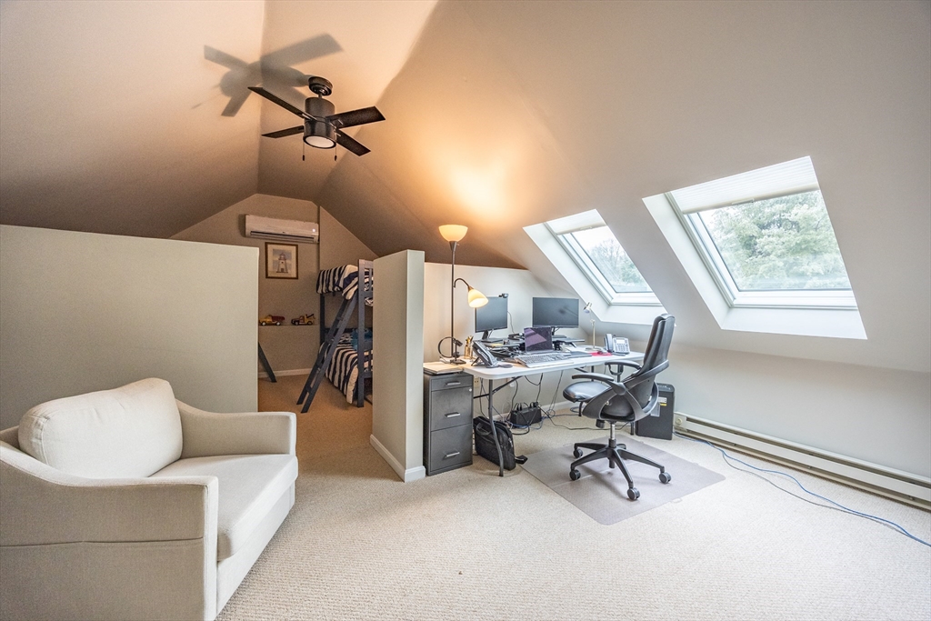 99 Stone Ridge Road, Unit 99 Franklin, MA 02038 - Photo 25 of 39 a work room with furniture and a window