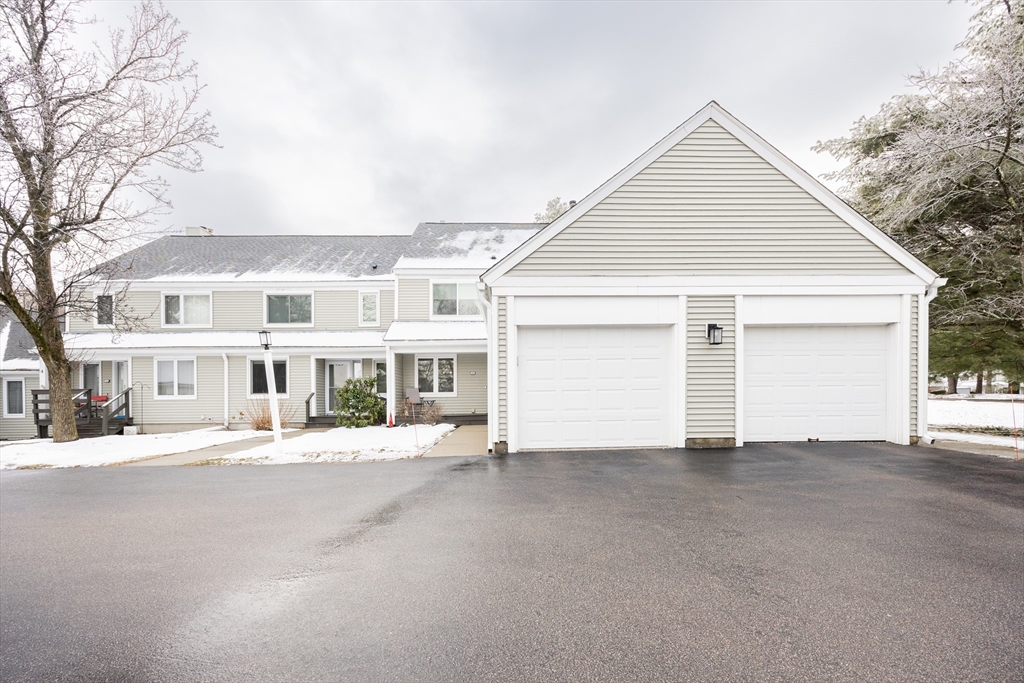 99 Stone Ridge Road, Unit 99 Franklin, MA 02038 - Photo 37 of 39 front view of a house next to a yard
