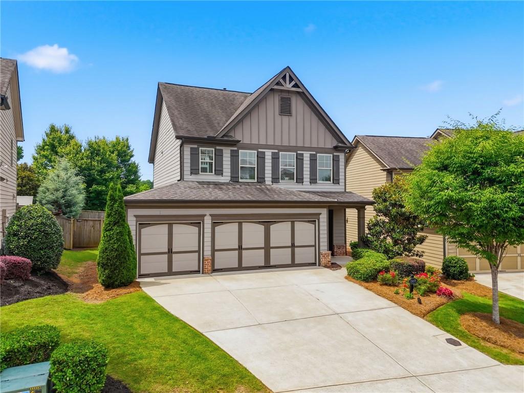 147 Fieldbrook Crossing Canton, GA 30115 - Photo 1 of 46 a front view of a house with a yard and potted plants